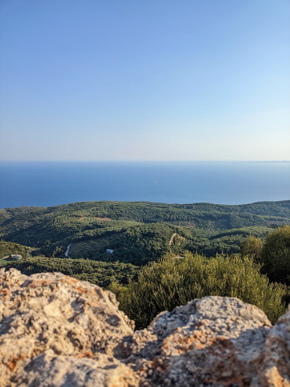 Olive groves with the Ionian Sea in the background, seen from the Ali Pasha (Anthousa) castle in Parga, Greece.