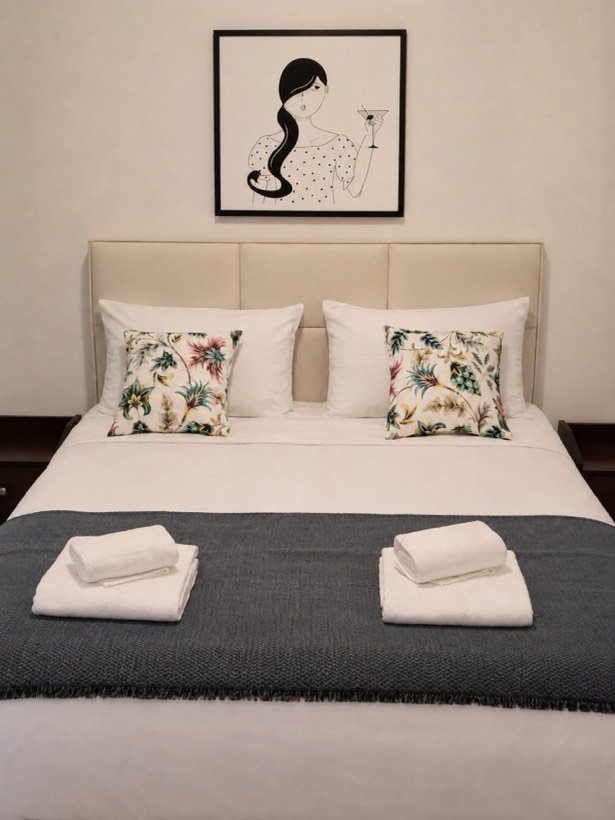 Double bed with upholstered headboard
