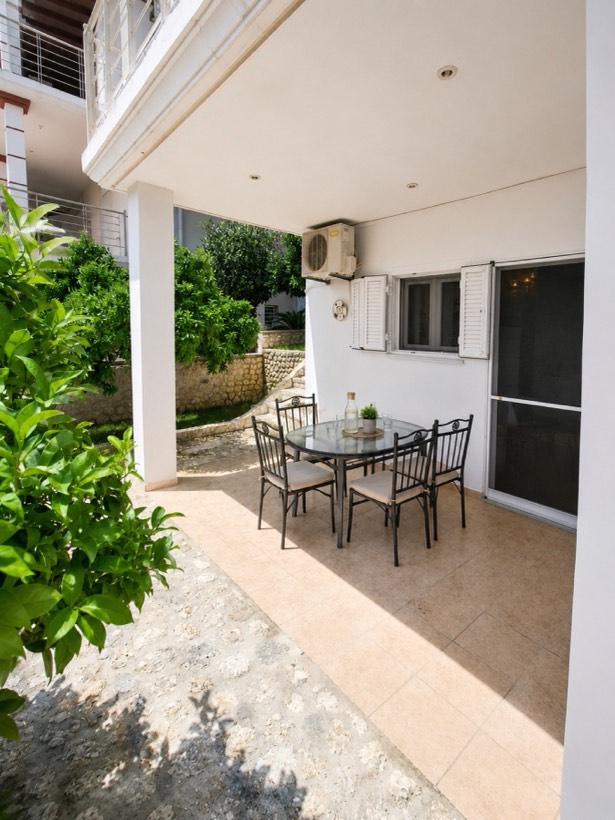Garden dining area framed by orange trees