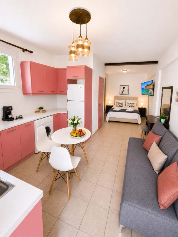 Open-plan Citrus Apartment with coral kitchen, sofa bed and double bed