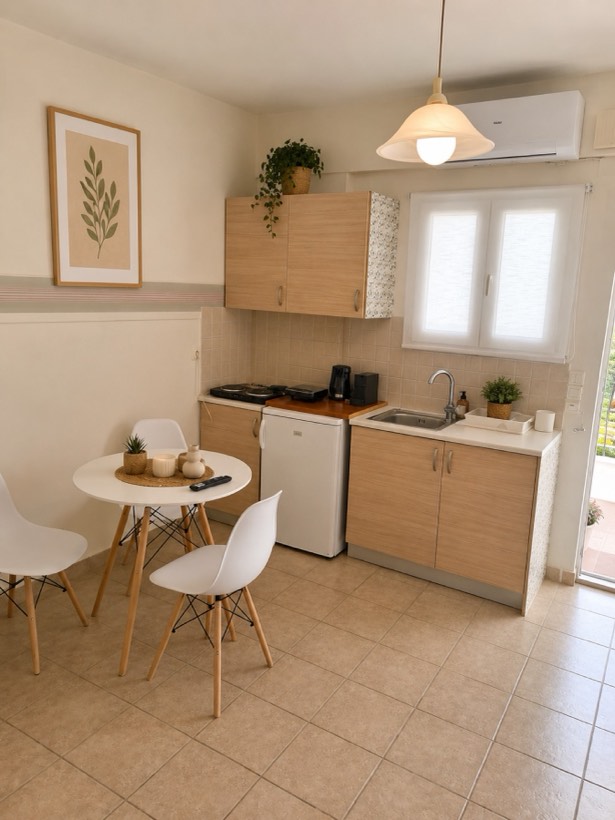 Light-wood kitchenette with dining table