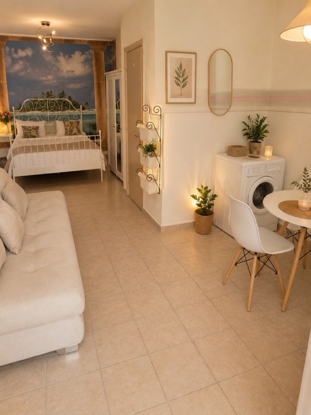 Studio view with washing machine and dining table